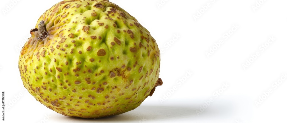 A tight shot of an unripened fruit against a pristine white backdrop, displaying minimal brown speckles A tight shot of an unripened fruit against a pristine white backdrop, displaying minimal brown speckles