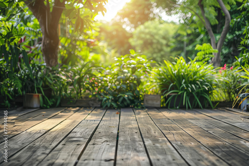 Empty wood table and defocused bokeh and blur background of garden trees with sunlight. Generative AI
