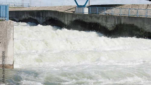 Static slow motion shot of fast flowing water on cascades of dam canal of Danube river in Dobrohost, Slovakia.