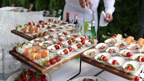 a food an snacks on the buffet table at the celebration of wedding birthday