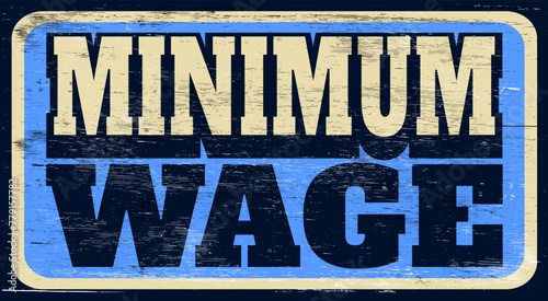 Aged and worn minimum wage sign on wood