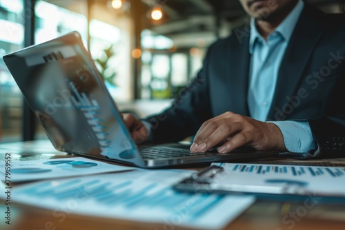 Cropped photo of businessman analyzing business. Computer screen with infographics.