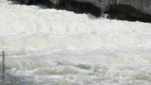 Static slow motion shot of fast flowing water on cascades of dam canal of Danube river in Dobrohost, Slovakia.