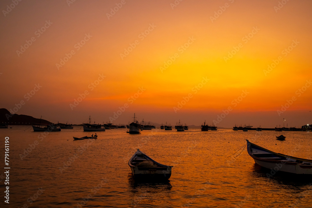 Fishing boats during a beautiful and colorful sunset in Juan Griego beach, Margarita Island. Venezuela