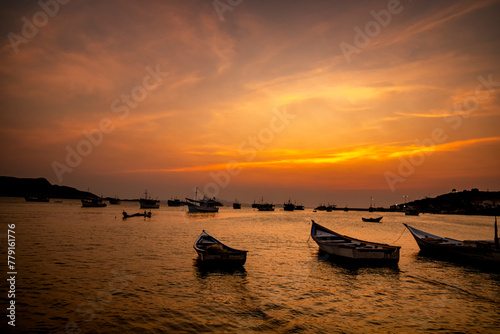 Fishing boats during a beautiful and colorful sunset in Juan Griego beach, Margarita Island. Venezuela