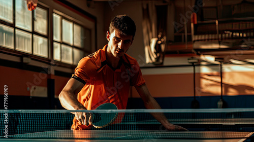 A man in an orange shirt is playing ping pong