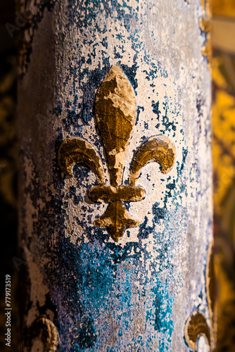 Symbol of the golden French lily known as "Lille de France" with blue background on a column in the Sainte Chapelle in Paris, Île-de-France, France.