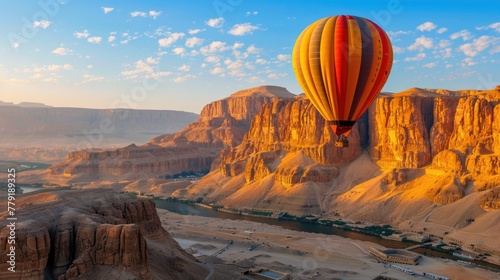 A majestic hot air balloon flying over a breathtaking canyon. Perfect for travel and adventure concepts