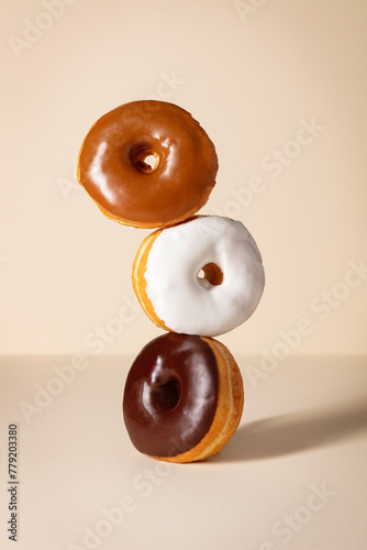 Three Stacked Glazed Donuts photo