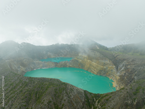 Aerial view of Kelimutu Lake with its turquoise crater photo