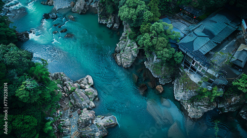 Aerial view of the H liquified river in Japan, surrounded by forest and buildings. Natural light with bluegreen tones in the surreal photography style of topdown angle
