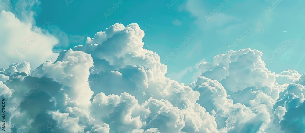 A commercial jet aircraft gracefully ascends through billowy cumulus clouds high in the blue sky - obrazy, fototapety, plakaty 