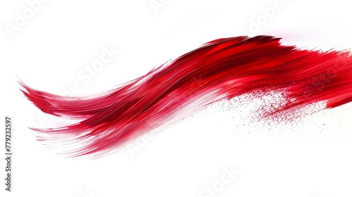 A soft and delicate red brushstroke on a white background. Eye-catching bright red brushstroke in a thin, wavy shape that suggests flowing liquid or dust.