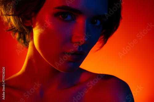 Photo of pretty sexy woman naked shoulders enjoying skin care empty space isolated red neon color background