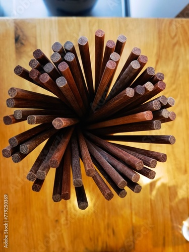 red chop sticks in a small invisible vase