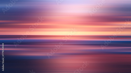 Abstract sun is setting over the ocean, casting warm glow on water. The sky is filled with clouds, creating a moody atmosphere. reflection of sun on water is a beautiful sight to behold, motion blur.