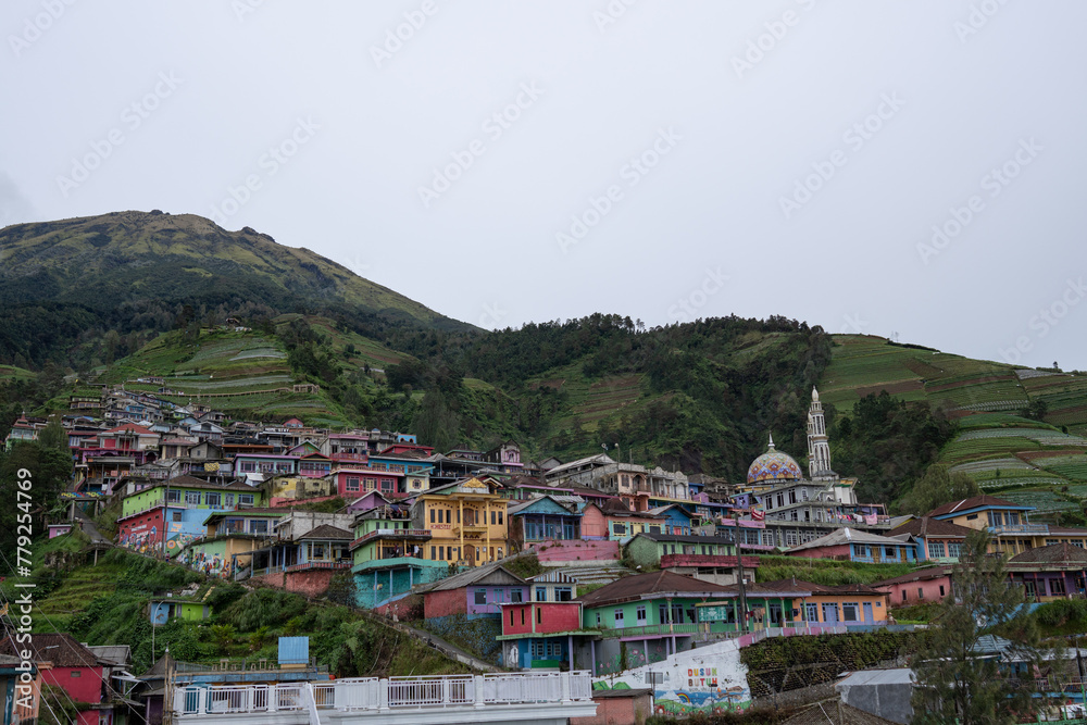 Aerial view of colorful houses on mountain slope in Central Java, Indonesia