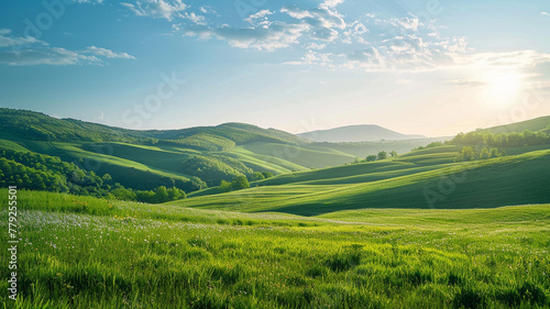 A peaceful countryside landscape with rolling hills and a clear blue sky.