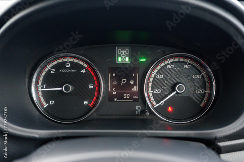 Canvas Print The dashboard of a car shows the speedometer at 120 mph