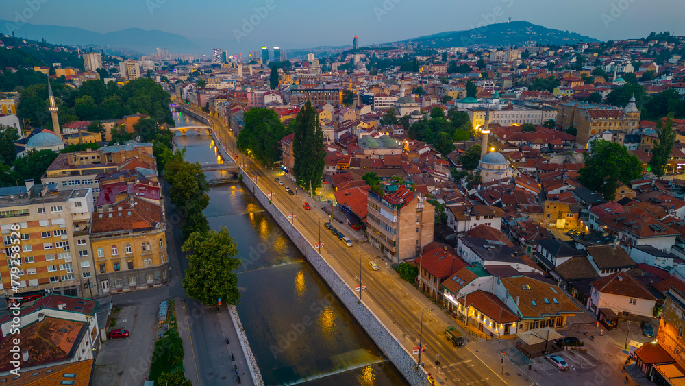 Naklejka premium Sunrise over Mlijacka river in the center of Sarajevo, Bosnia and Herzegovina