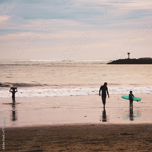 Photography Father taking sons winter surfing