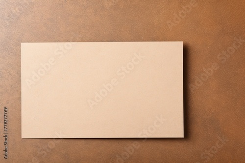 Tan blank business card template empty mock-up at tan textured background with copy space for text photo or product © Lenhard