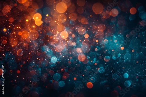 Vibrant abstract of defocused bokeh light spots in shades of orange and blue evoking excitement