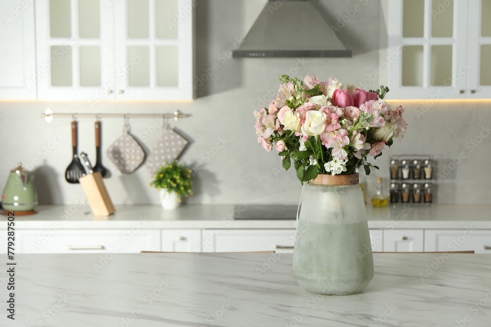 Beautiful bouquet of fresh flowers in vase on table indoors, space for text