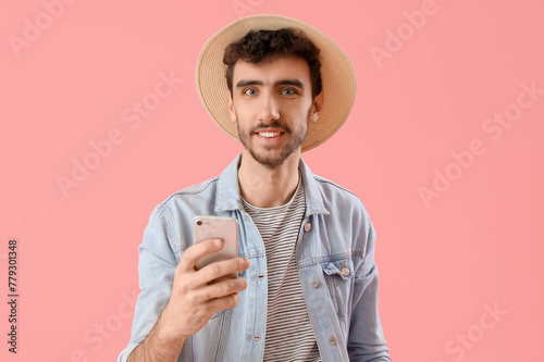 Handsome young man using mo...