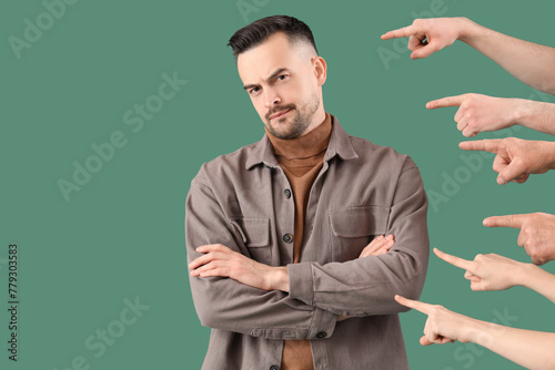 People pointing at young ma...