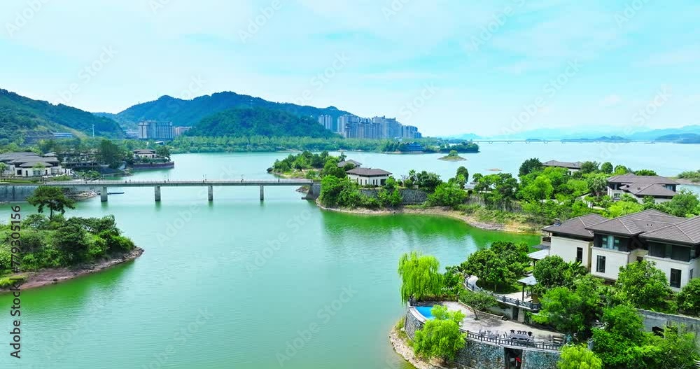 Aerial view of resort town buildings scenery by the lake in Qiandao Lake. Quiet living environment. clear lake with green mountain natural landscape in Hangzhou. Aerial view of resort town buildings scenery by the lake in Qiandao Lake. Quiet living environment. clear lake with green mountain natural landscape in Hangzhou.
