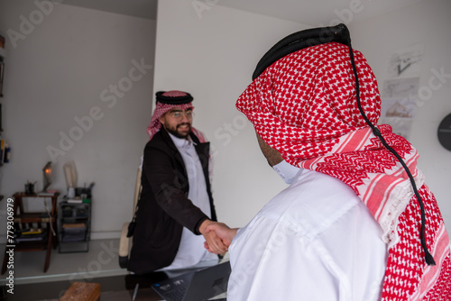 Agreement between two arabian men while shaking hands