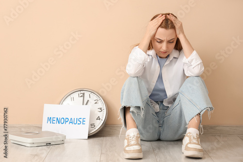 Upset mature woman with clo...