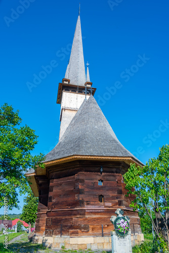 Wooden Church St. Archangels in the village Plopis in Romania photo