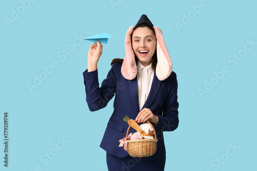Happy stewardess in bunny e...