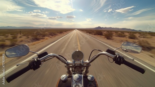 Desert Highway Motorcycle Ride at Dusk - An open desert highway with a rider's perspective on a motorcycle creates a sense of an endless journey photo