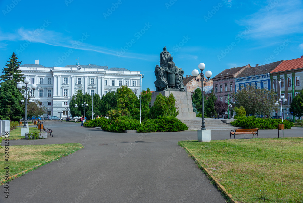 Naklejka premium Heroes monument and Ioan Slavici Classical Theater in Romanian town Arad