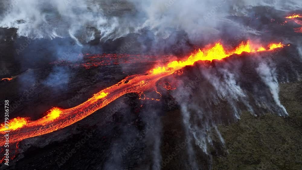 Volcano eruption, red hot burning lava erupting close up, drone fly over crater in Iceland