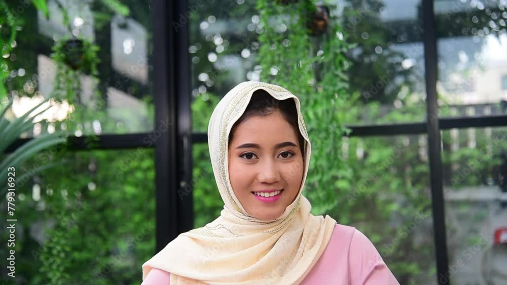 Muslim woman wear hijab smile face look at camera. Portrait Muslim women happy smiling face cheerful. Young Asian arabian middle eastern muslim people head scarf smiling confident attractive person Muslim woman wear hijab smile face look at camera. Portrait Muslim women happy smiling face cheerful. Young Asian arabian middle eastern muslim people head scarf smiling confident attractive person