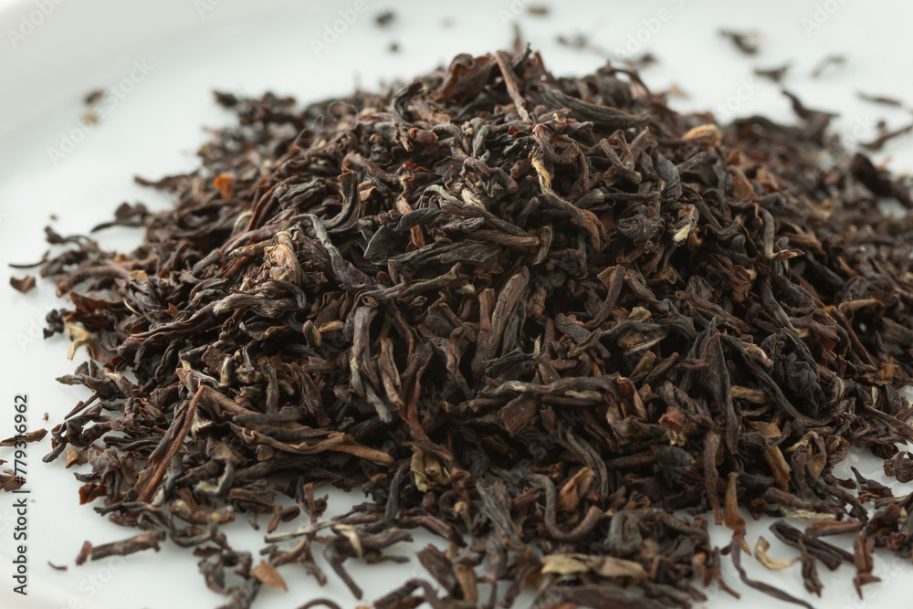 A closeup view of a pile of loose leaf Naming Upper Vintage Muskatel Darjelling black tea.