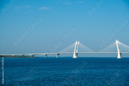 A cable-stayed concrete bridge with supports across the bay.