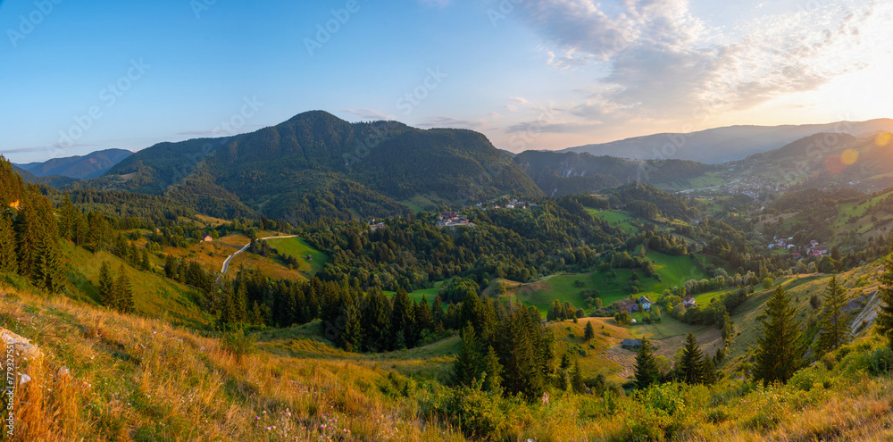 Naklejka premium Sunset view of a village in a valley in Transylvania, Romania