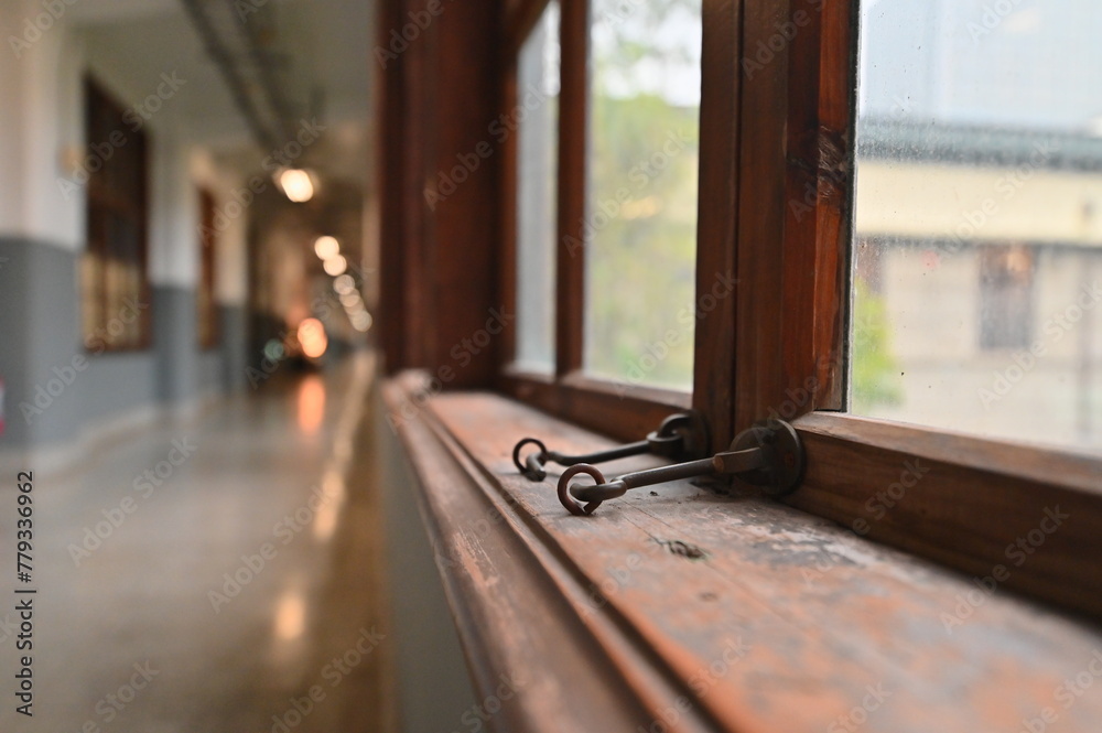 Fototapeta premium TW - 01.24.24: The wooden framed windows inside Songshan Cultural and Creative Park (formerly Songshan Tobacco Factory), built in 1937, bear witness to Taiwan's industrial and architectural history.