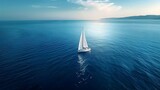 A white sailboat on the horizon of blue sea, wide shot. For Design, Background, Cover, Poster, Banner, PPT, KV design, Wallpaper