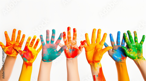 Children's day , close up of child hands painted with watercolors against white background.