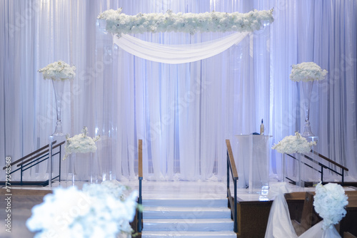 Beautiful photo of the Jewish Hupa , wedding putdoor .Beautifully registered Huppa with a petals of roses are laid out a heart photo