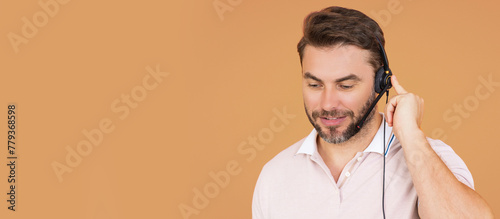 Banner of customer service representative wearing a headset isolated on beige. The Call center. Portrait of man with headset. Customer support operator. Technical support. Call center operator.
