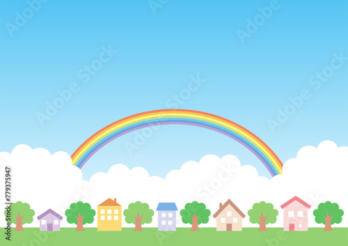カラフルな家と虹のかかった空の背景
