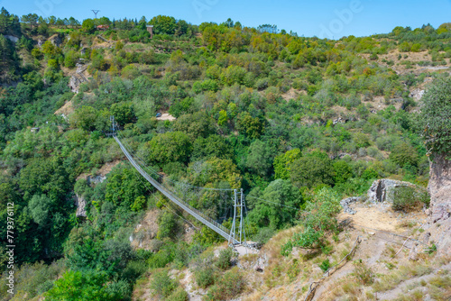 Suspension bridge leading to Old Khndzoresk abandoned cave town in Armenia photo