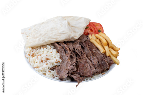 Turkish dish consisting of spiced lamb cooked on a spit and served in slices, typically with pita bread.